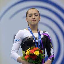 Ea spune că, din cauza lipsei de personal, a schimbat costumul de gimnastică cu cel de polițist. Larisa Iordache Artistic Gymnast Profile Biography Achievements
