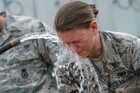 Airman 1st Class Kameron Freeman soothes her face with
