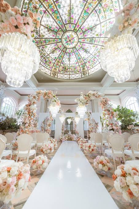 Multi-layered crystal chandeliers and floral arches for grand ceiling architecture, AI generated
