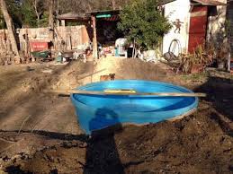 We Decided To Bury Our 8 39 Poly Stock Tank In The Backyard To Make It An In Ground Pool Or Litt Stock Tank Pool Diy Stock Tank Pool Stock Tank Swimming Pool