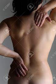 Nude Woman With A Back Pain Stock Photo, Picture and Royalty Free Image.  Image 47402878.