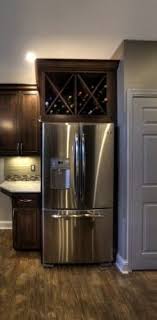 Take Cabinet Doors Off Above Fridge And Convert To Wine Storage Nice Those Cabinets Are Useless Anyway I Think I N Home Kitchens Home Remodeling Sweet Home