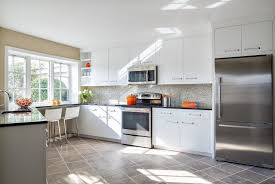 White marble tiles add to the light and airy feel in this compact kitchen. 36 Inspiring Kitchens With White Cabinets And Dark Granite Pictures Home Stratosphere