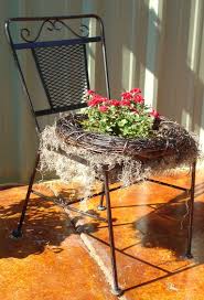 Repurposed Metal Patio Chair Originally Bought At Yard Sale Used 7 Years Now Has New Life As A Flower Garde Garden Chairs Floral Chair Metal Patio Chairs