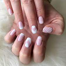 Rhinestone nails like these are great for the ladies who want to mix up their nail designs while keeping it chic. Light Pink Glittery Nails Novocom Top