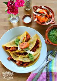 pork carnitas in guajillo sauce tacos
