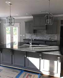 So today, we're going to take a close look at this popular gray paint colour to see if it could work for you and your home! Sherwin Williams Dovetail Kitchen Cabinets With Black Pearl Granite Countertops Pfister Zur Black Granite Countertops Backsplash Black Granite Kitchen Remodel