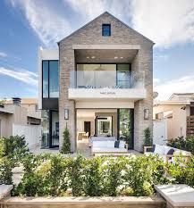Balcony design outside with glass. Glass Balcony Over Patio Transitional Home Exterior