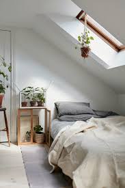 A Bedroom With Slanted Ceiling