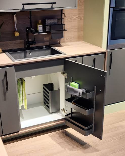 Completed organised under sink cabinet in a modern Mauritian kitchen