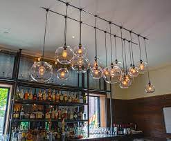 If you're designing a new bar or trying to improve the look of an existing one, here are some of the top bar lighting ideas to consider. Sweet Sixteen Installation At Roundhouse Features Crystal Glass Pendants Antique Pendant Light Home Lighting Design Bar Pendant Lights