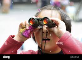 Through binoculars asia hi-res stock photography and images