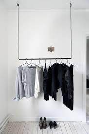 The hanging clothes rack comes with 2 wire netted grids to be placed on the underside part of the rack, which is used as a shelf and could be taken out when not. Simple Hanging Pole With Wire To Hang Clothing Closet Designs Vintage Laundry Room Decor Clothing Rack