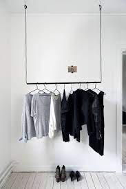 Wire rack for hanging clothes. Simple Hanging Pole With Wire To Hang Clothing In 2020 Hanging Clothes Racks Clothing Rack Closet Designs