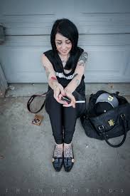 Gypsy face in heart frame with dagger tattoo on thigh. Jessica Clark The Hundreds