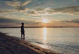 I think sunset, midday, sunrise or midnight i dont know but these are the answers i can give and atleast i told u somethink lol at midday, when the a simple experiment : Silhouette Boy Standing At Shore Against Sky During Sunset Stockphoto