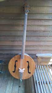 C659caab2d248daddeda5e81b39a2f20 Homemade Instruments Cookie Tin Jpg 736 1 307 Pixels Upright Bass Homemade Instruments Cigar Box Guitar