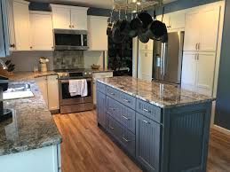 White Cabinets Set Off By Leisure Blue Sherwin Williams Paint With A Gray Island Dia Painted Kitchen Cabinets Colors Dark Blue Kitchens Blue Kitchen Cabinets
