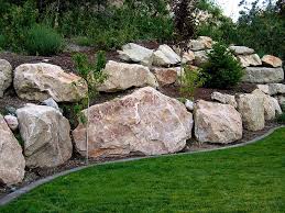 What S The Deal With My Retaining Wall Garden City Florascaping In 2020 Landscaping With Boulders Rock Wall Landscape Landscaping Retaining Walls