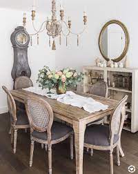 Chic dining room features a beadboard ceiling accented with an antique brass bryant chandelier illuminating a round gray dining table, seats 6, lined with french square back dining chairs, restoration hardware vintage french square fabric side chairs. 37 Charming French Country Dining Rooms