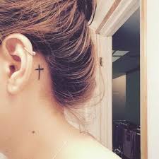 A great design for a little star tattoo is to get a simple outline of a star; Awesome Cross Tattoo Behind Ear Body Tattoo Art