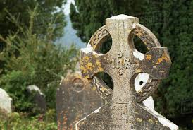 Old Weathered Tombstone; Ireland - Stock Photo - Dissolve