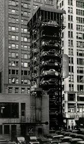 It costs $14 in tolls to get a car into manhattan, and parking averages $30 per day. Elevator Garage With Parking Lot Old Photos History Historical Photos