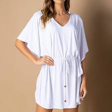 Saída de praia búzios é uma peça muito exclusiva amada por nossas clientes. Saida De Praia Kaftan Karen Branco Flui