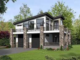 Modern styling, metal roof, thinset stone veneer, and cedar siding help set this 2 car apartment garage apart from its competition. Modern Garage Home Plans Novocom Top