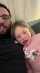 Daughter Keeping Straight Face Dad Talking about Wheels Going Round