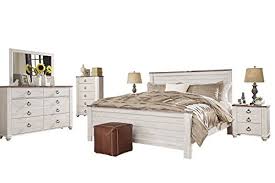 Features 2 drawers accented by shaped ring pulls in an antique brass finish. Ashley Willowton 6pc E King Panel Bedroom Set With Two Nightstand Chest In White Buy Online In Brunei At Brunei Desertcart Com Productid 75902101