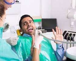 Image of person feeling anxious in a dental chair