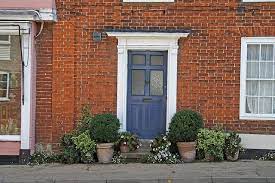 Pink is a whimsical choice for front door colors. Blue Door Brick House Red Brick House Brick House Front Door Colors House Shutters
