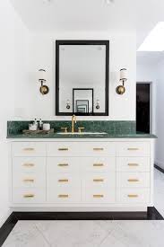 Black And White Marble Floor Bathroom Marble Floor Tiles Framed By Black Tiles Lead To A White Washstand Fitted With Brass Hardware An Marble Tile Floor Green Marble Bathroom White Marble Bathrooms