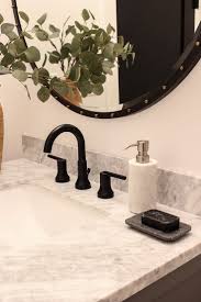 Our Finished Little Powder Bath With Delta The House Of Silver Lining Delta Faucets Bathroom Black Faucet Bathroom Round Mirror Bathroom