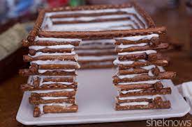 It wouldn't have occurred to me to use the glue gun, nice tip. How To Make An Edible Snow Covered Pretzel Log Cabin Sheknows
