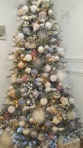 Download this free vector about white christmas baubles background, and discover more than 9 million professional graphic resources on freepik. A Sophisticated Tree With Large Starburst White Birds And Baubles Filled Wi Christmas Themes Decorations Christmas Decorations Tree Christmas Tree Decorations