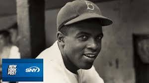 Jackie Robinson becomes first African American to play MLB
