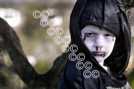 26250711-Crookston Castle Pr teacher Sarah-Jane Caldwell with the pupils  from her school who worked in the book Droopy Discovers Europe. Sarah Jane  and Demi Sheldon 9 have a close look at the