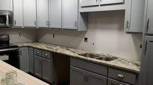 We take each project seriously. Ice Brown Granite With Grey Shaker Cabinets Grey Shaker Cabinets Beige Countertops Grey Cabinets