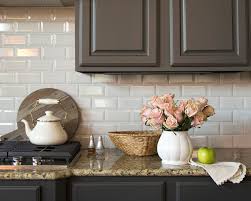 Elegant kitchen features a coffered ceiling fitted with pot lighting and a pair of crystorama solaris chandeliers illuminating a gray kitchen island with turned legs painted benjamin moore kendall charcoal topped with a white marble look alike countertops, sea pearl quartzite, fitted with farmhouse sink and satin nickel gooseneck faucet. Kitchen Cabinets And Shiplap Walls In Kendall Charcoal Farmhouse Kitchen Austin By Paper Moon Painting Houzz