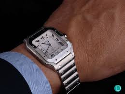 He needed a watch he could easily operate while flying his. Smaller And Better The New Cartier Santos 2018 Cartier Watches Mens Stylish Watches Men Luxury Watches For Men