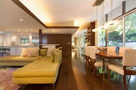 The colors are earthy and neutral with some pops of color. Mid Century Mod Affordable Interior Design Miami