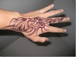 The term is rather broad in its coverage, though. 55 Awesomest Tribal Tattoo Designs For Males And Ladies Tribal Hand Tattoos Hand Tattoos For Guys Tribal Tattoos