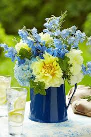 Pale Yellow Light Blue And A Punch Of Navy Or Royal Blue Flower Arrangements Simple Centerpieces Beautiful Flowers