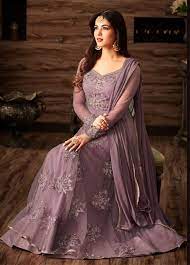 It was in the era of 60s to 80s when anarkali suits were in fashion, the trend has repeated itself and now a lot of women love to flaunt themselves wearing colourful anarkalis at various occasions. Sonal Chauhan Lavender Color Netted Wedding Anarkali 4807 Indian Fashion Dresses Indian Gowns Dresses Indian Designer Outfits
