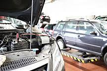 A preferable location is near a highway or busy road with a large parking area. Car With Open Bonnet In Garage Stockphoto