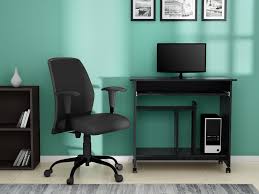 Attractive table conceals messy cables and wiring; Buy Caliber Computer Table In Black Godrej Interio