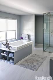 Modern bathroom with a curbless shower, gray tile, grey walls, grey floor and an open shower. 14 Best Gray Bathroom Ideas Chic Gray Bathroom Design Pictures