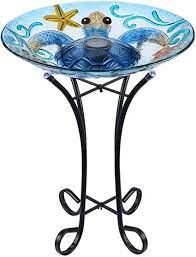 Bird baths attract different types of birds that may not visit traditional feeders but love the steady source of water. Amazon Com Mumtop Glass Bird Bath Bird Baths For Outdoors Solar Powered Bird Feeder With Metal Stand For Garden Yard Lawn Decor Sea Turtle Pattern Blue 21 5 X18 Patio Lawn Garden